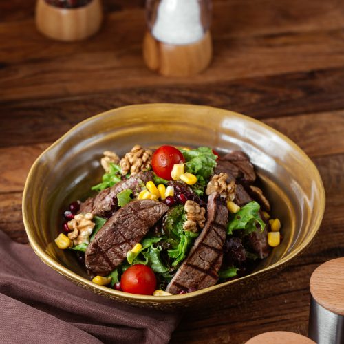 front-view-fried-meat-with-vegetables-inside-plate-brown-wooden-desk-food-meal-meat